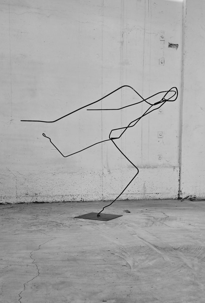 Iron rod sculpture Flight by Gergana Toleva depicting the moment of paragliding takeoff